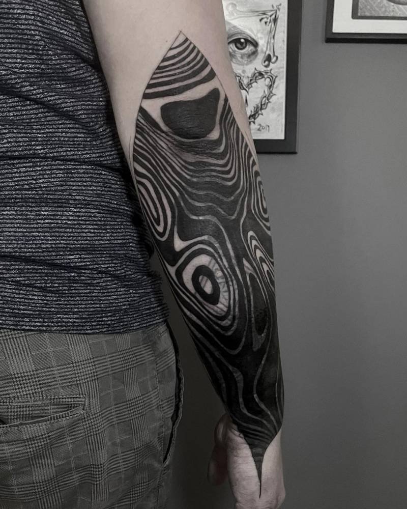 Bold suminagashi forearm half-sleeve swirling across skin