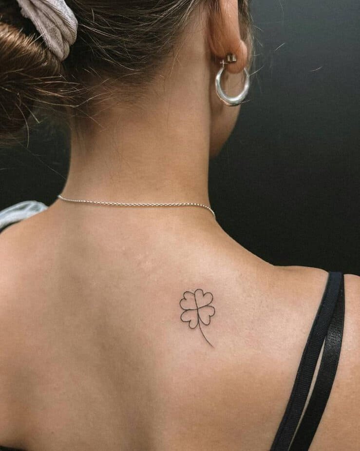 Back clover tattoo for timeless luck