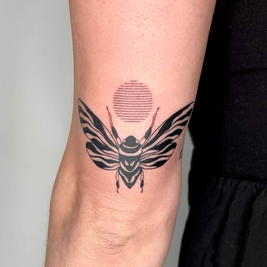 Sunset cicada tattoo