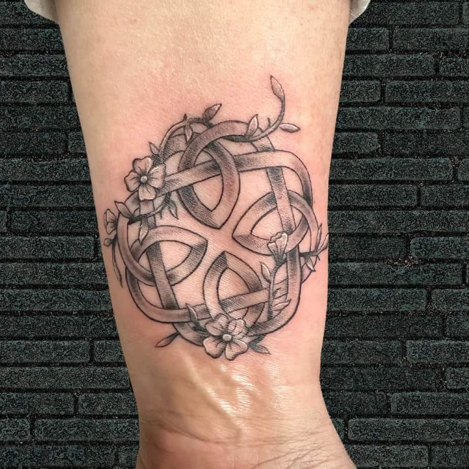Floral Celtic knot wrist tattoo