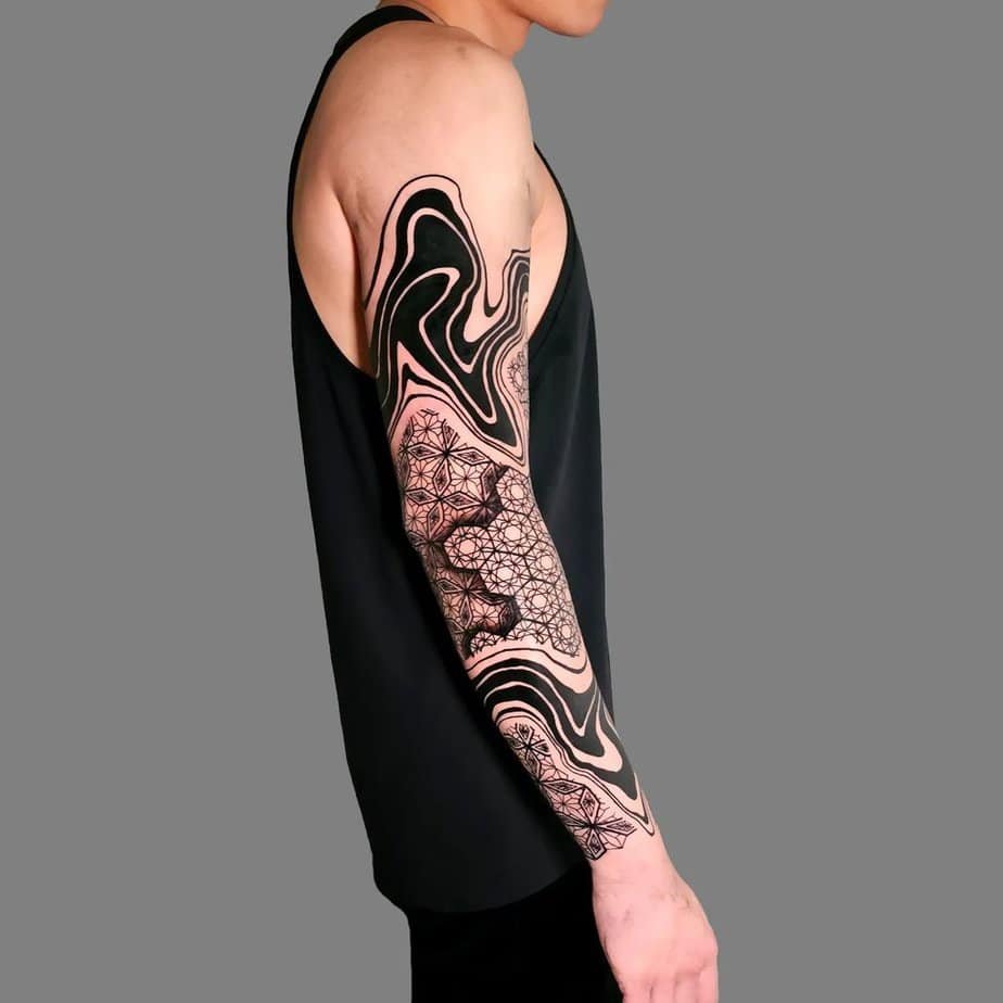Full sleeve with suminagashi flowing into geometric contrast