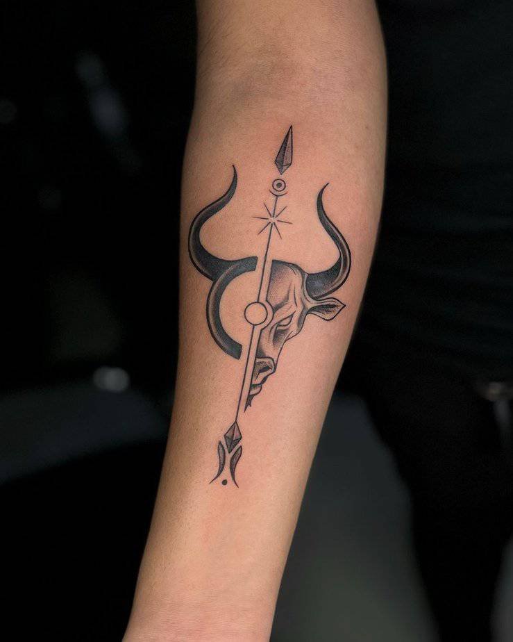 Spear piercing bull head tattoo