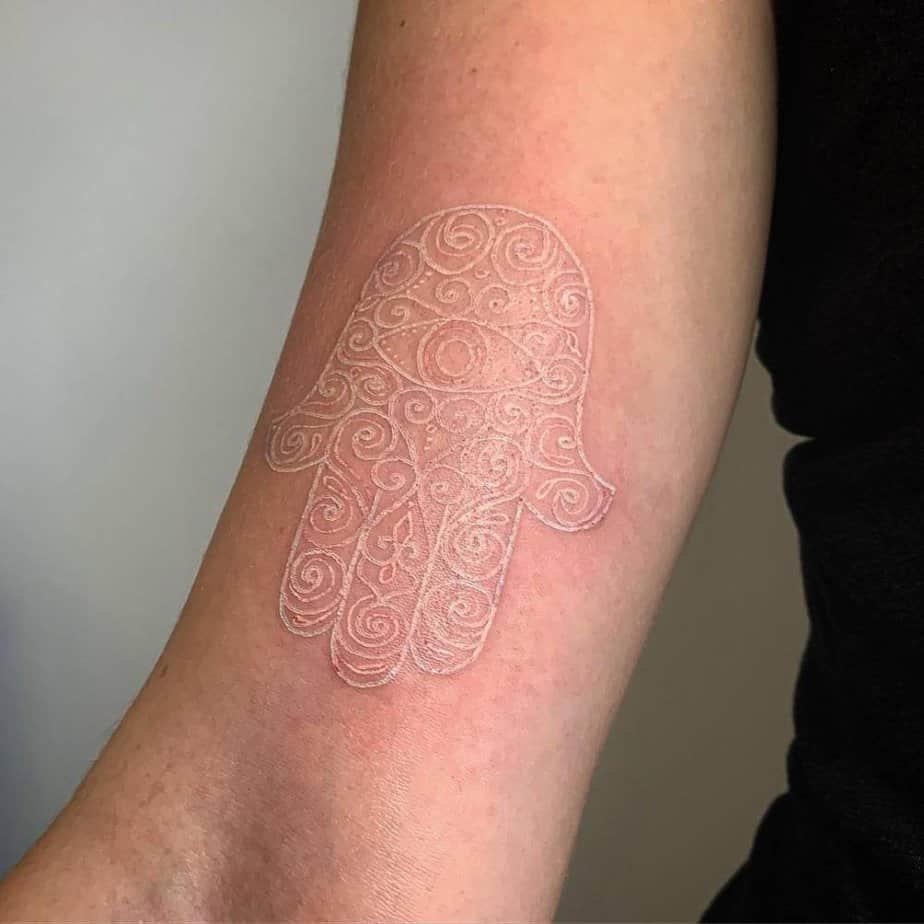 White ink hamsa hand tattoo