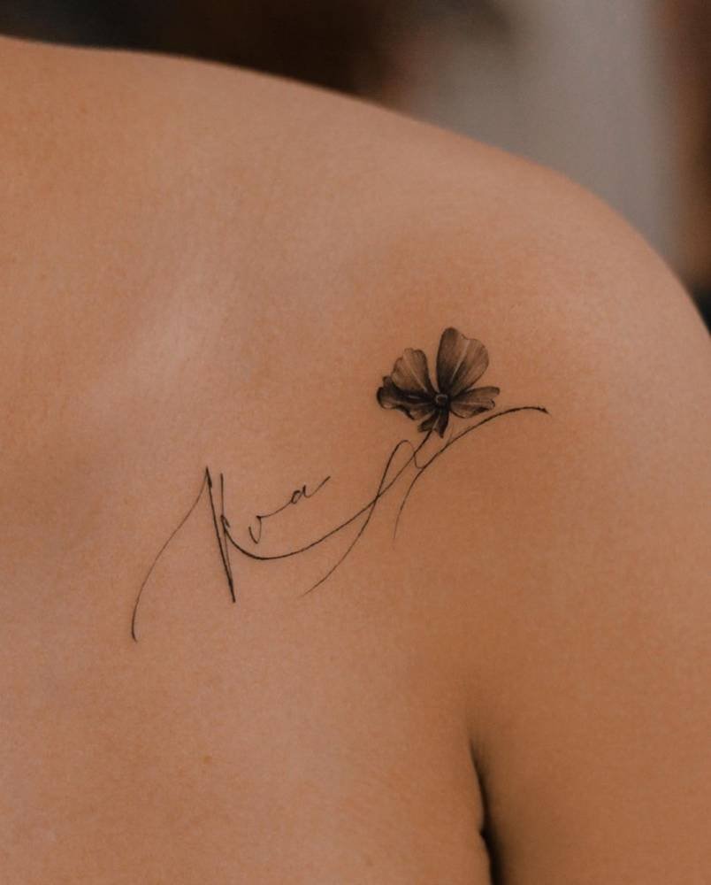 Elegant clover and signature tattoo