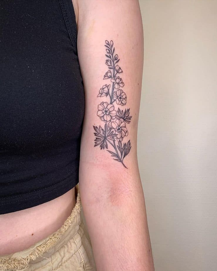 Simple larkspur bouquet tattoo