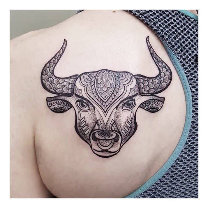 Ornate bull tattoo for the shoulder