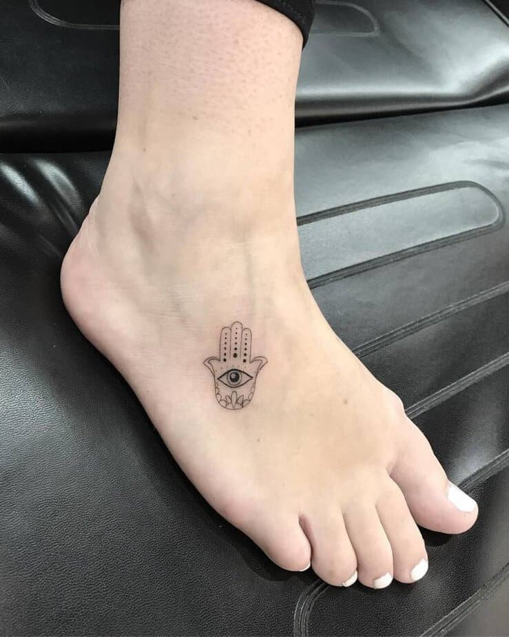 Tiny hamsa hand on the foot