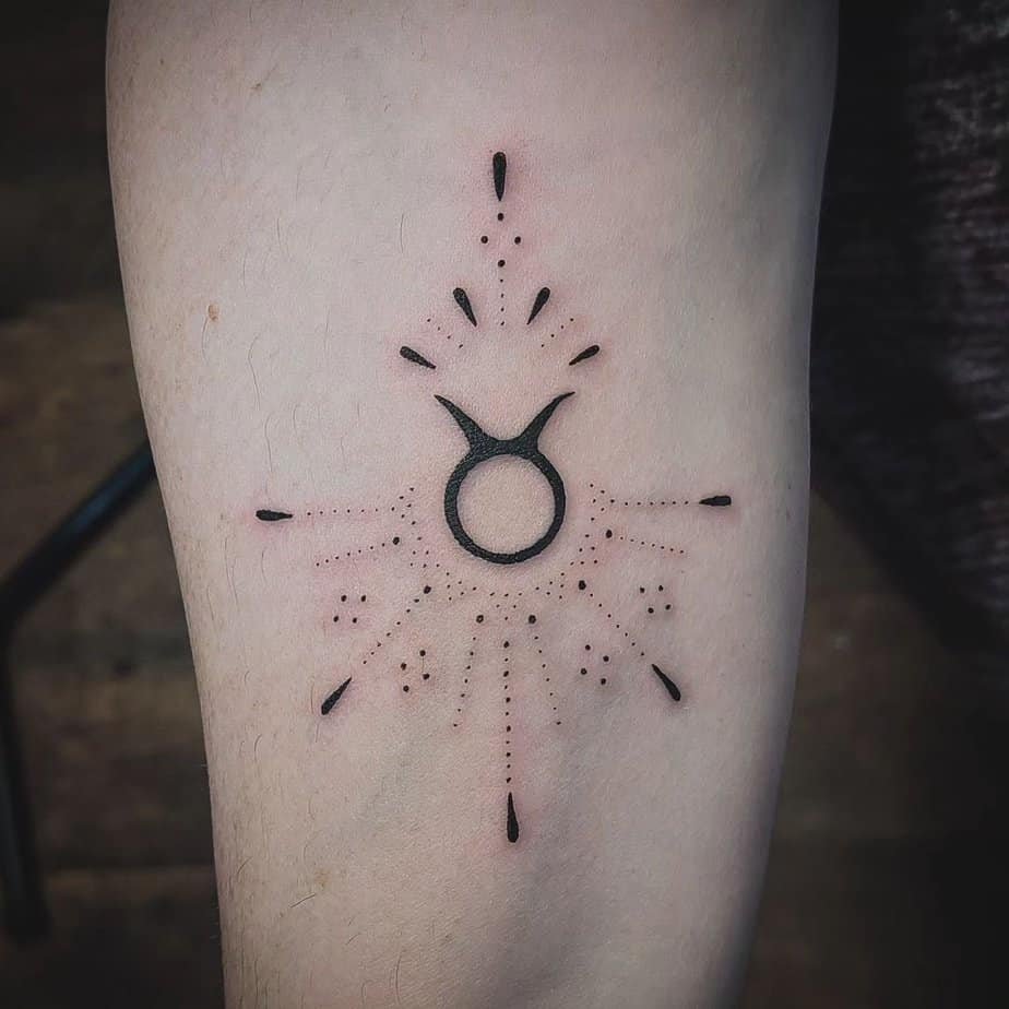 Minimalist Taurus symbol with dot work