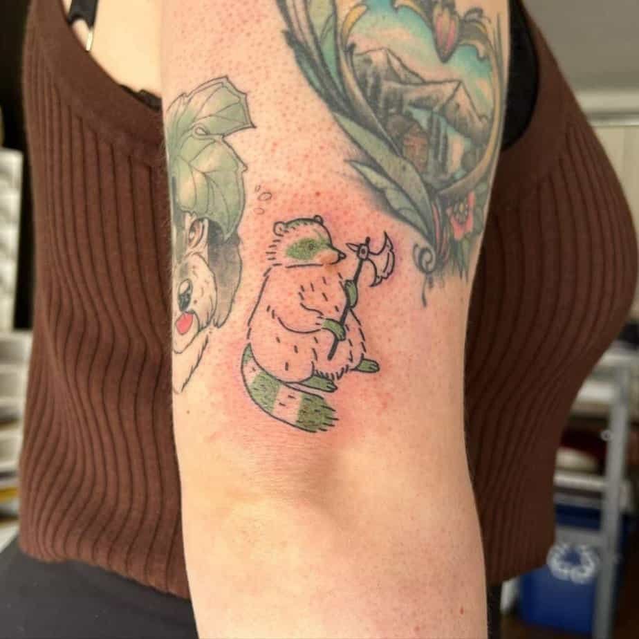 Green raccoon tattoo