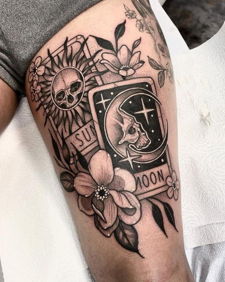 Sun and Moon tarot cards tattoo on thigh