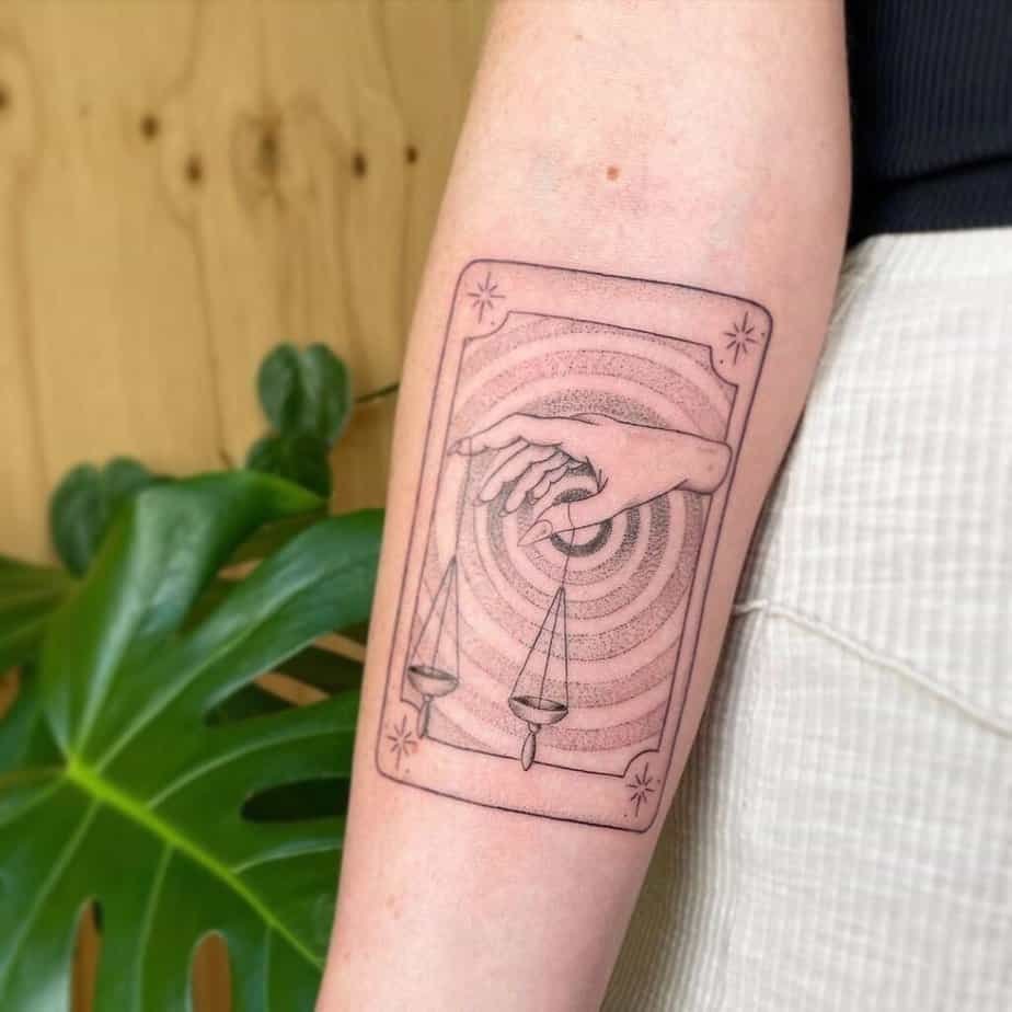 Tarot card forearm tattoo