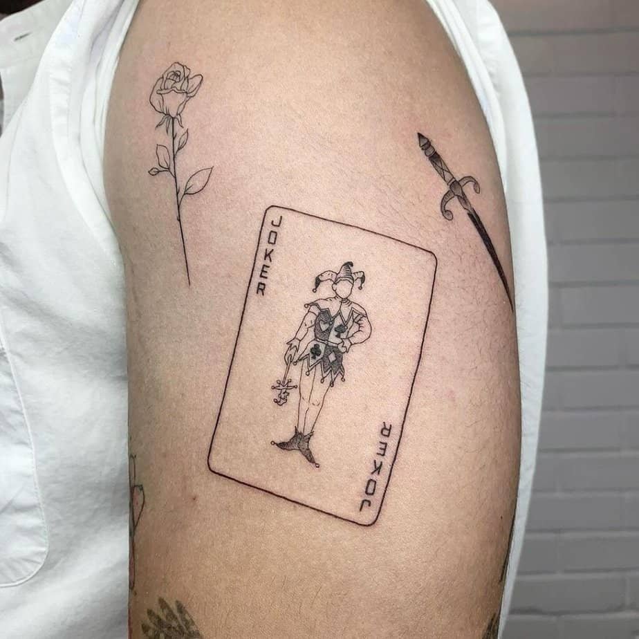 Upper arm Joker tattoo