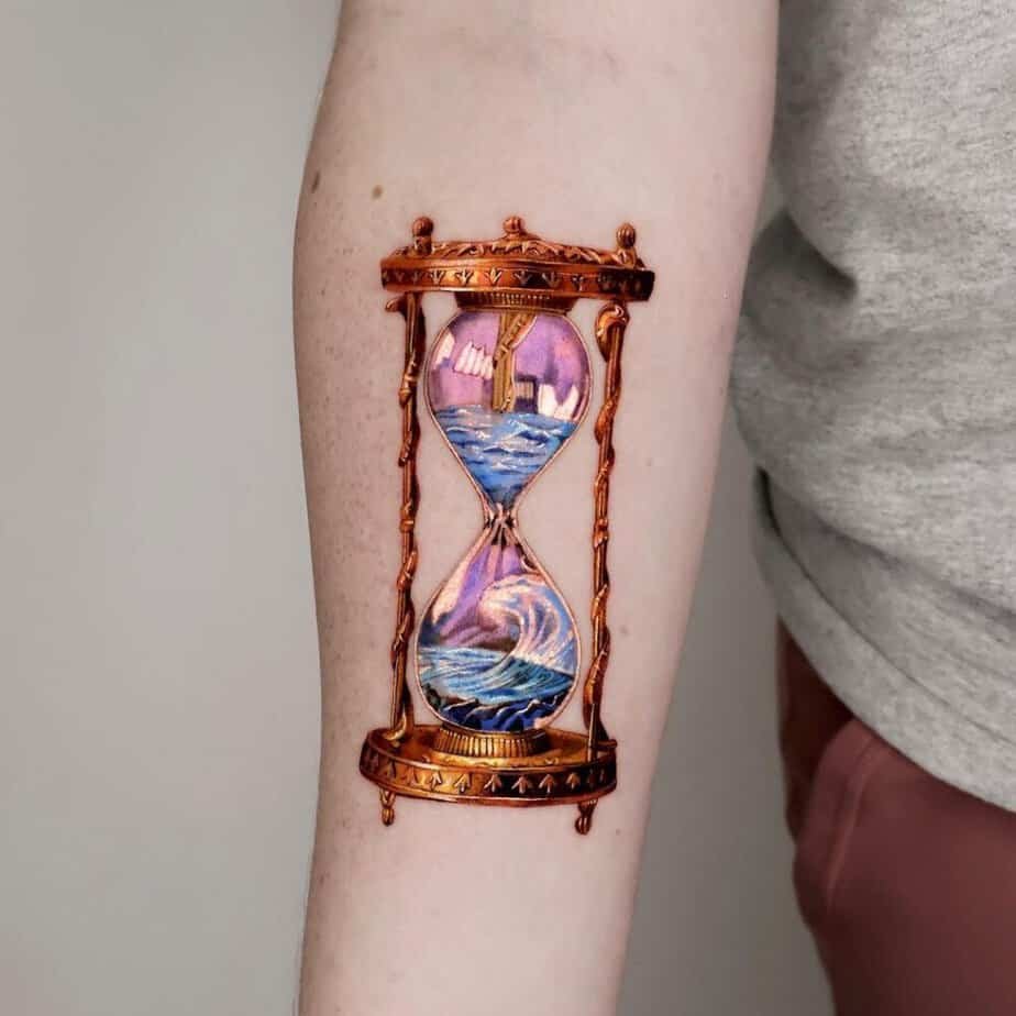 20. Artistic waves hourglass tattoo