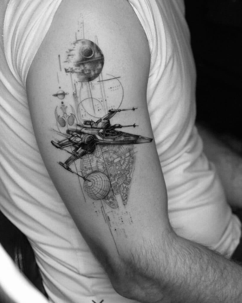 Delicate Star Wars tattoo on upper arm