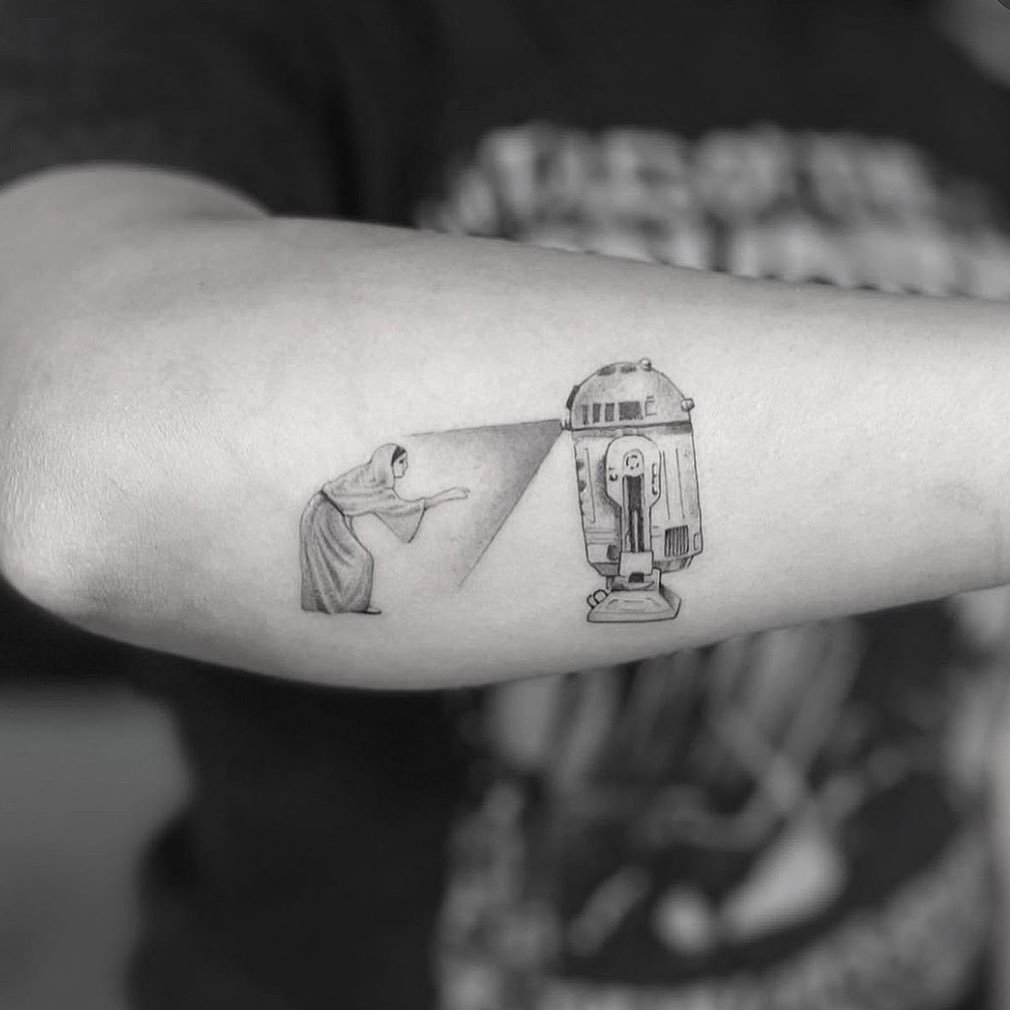 Scene tattoo on side of arm