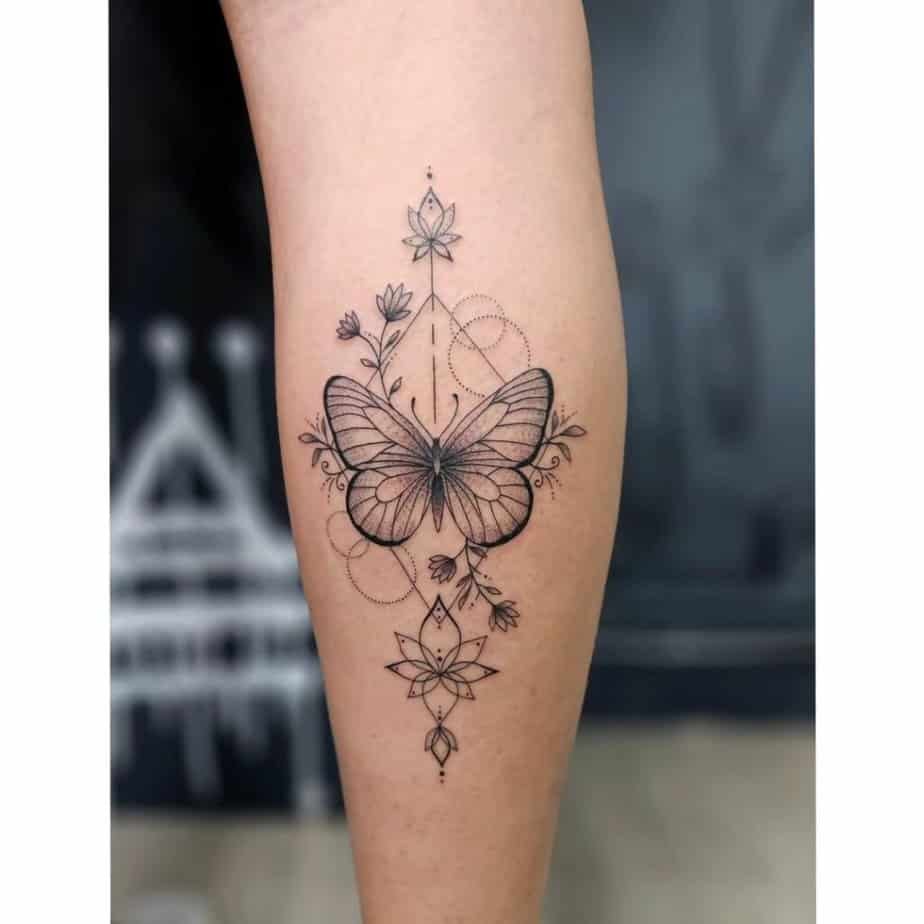 Dainty butterfly calf tattoo