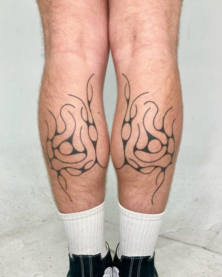 Abstract lines calf tattoo