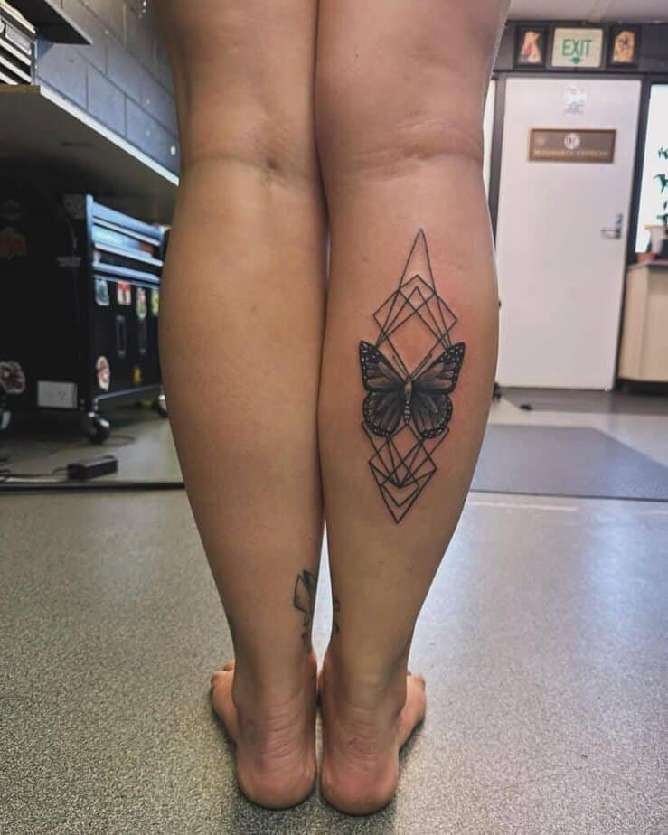 Geometrical butterfly calf tattoo