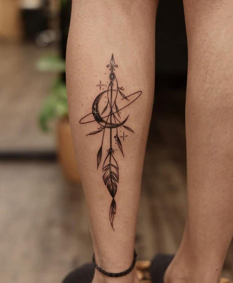 Moon and feather calf tattoo