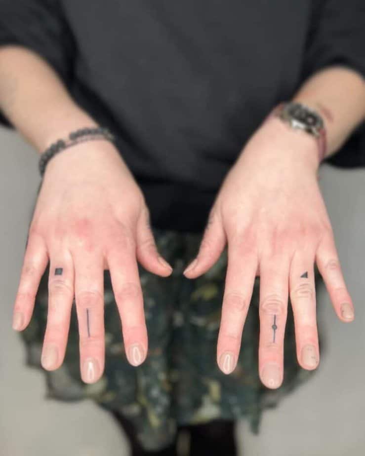 15. A tiny triangle tattoo on the finger