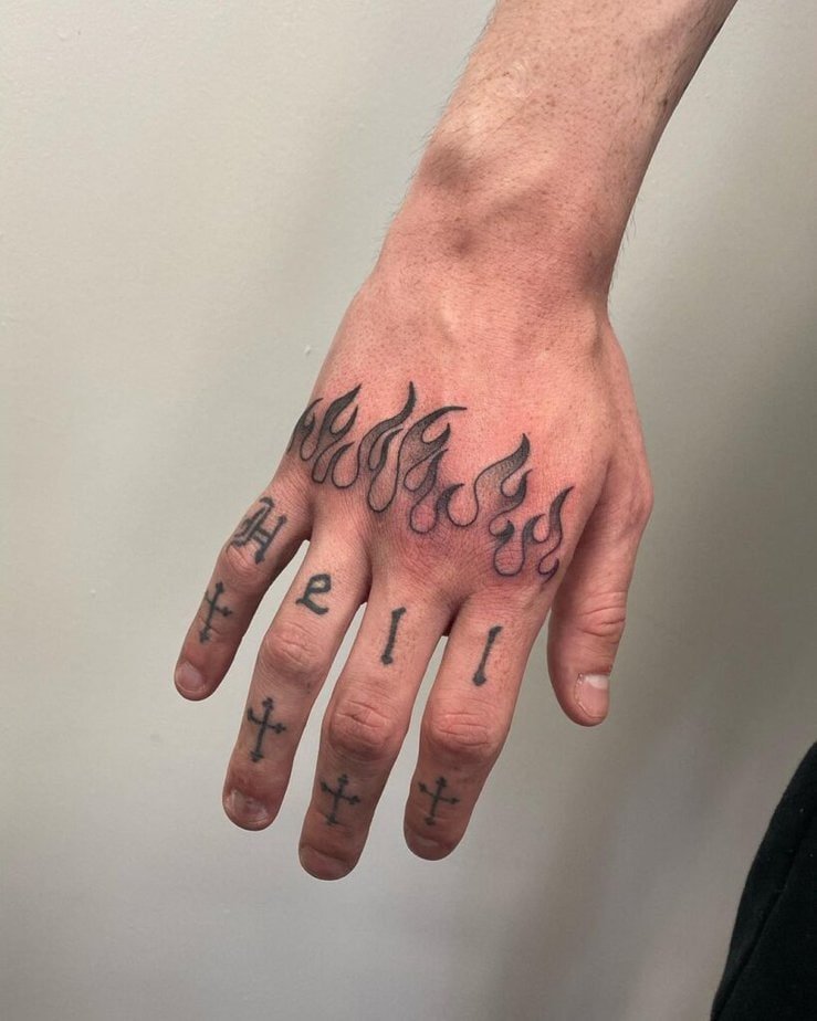 7. Religious knuckle tattoo