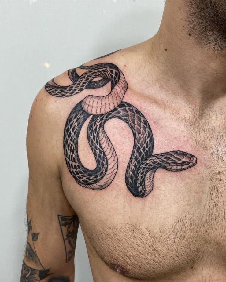 1. A cobra tattoo on the shoulder