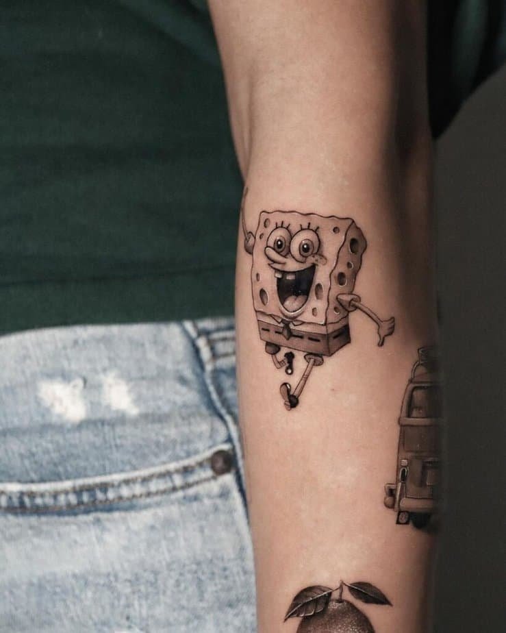 14. A black and gray SpongeBob tattoo