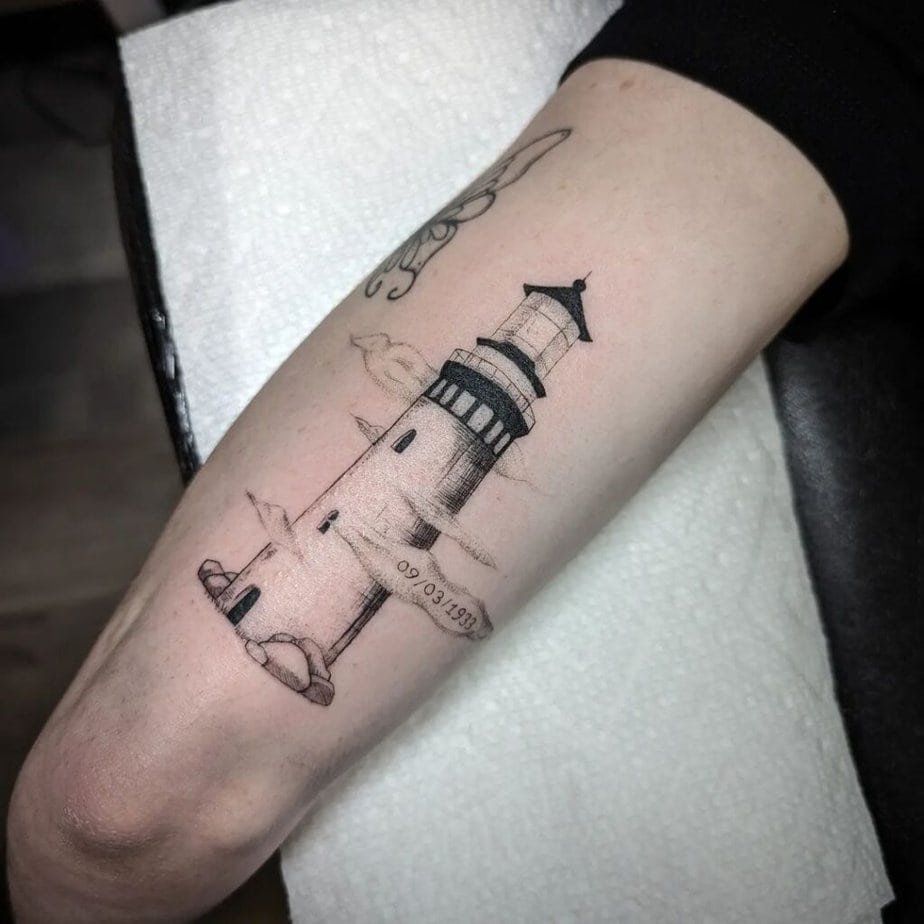 15. Memorial lighthouse tattoo