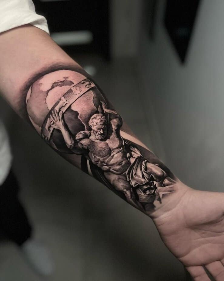 1. A realistic Atlas tattoo on the forearm