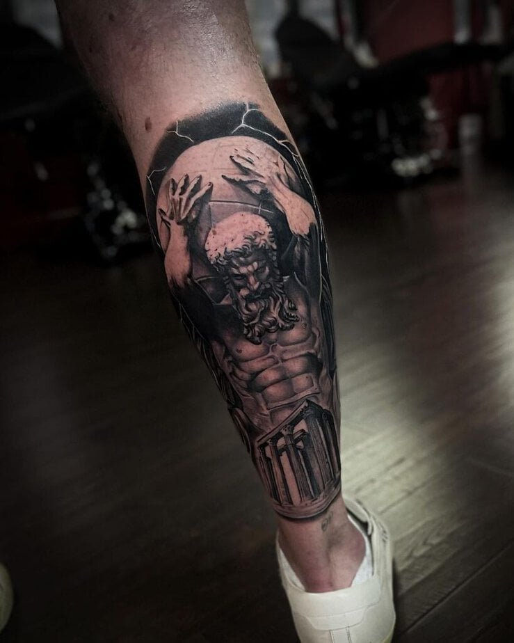 18. A tattoo of Atlas on the back of the leg