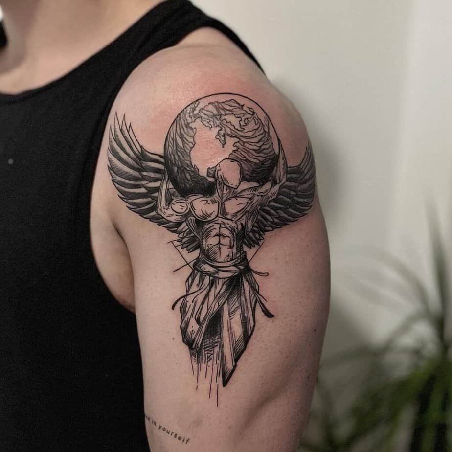2. A sketch-style Atlas tattoo on the upper arm
