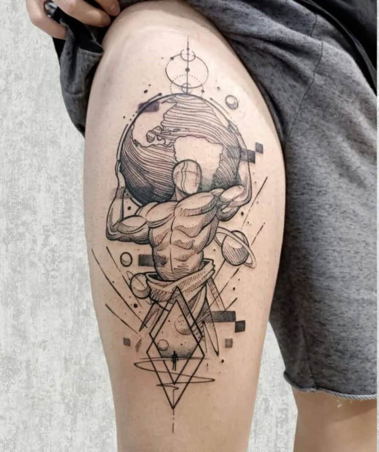 3. A sketch-style Atlas tattoo on the thigh