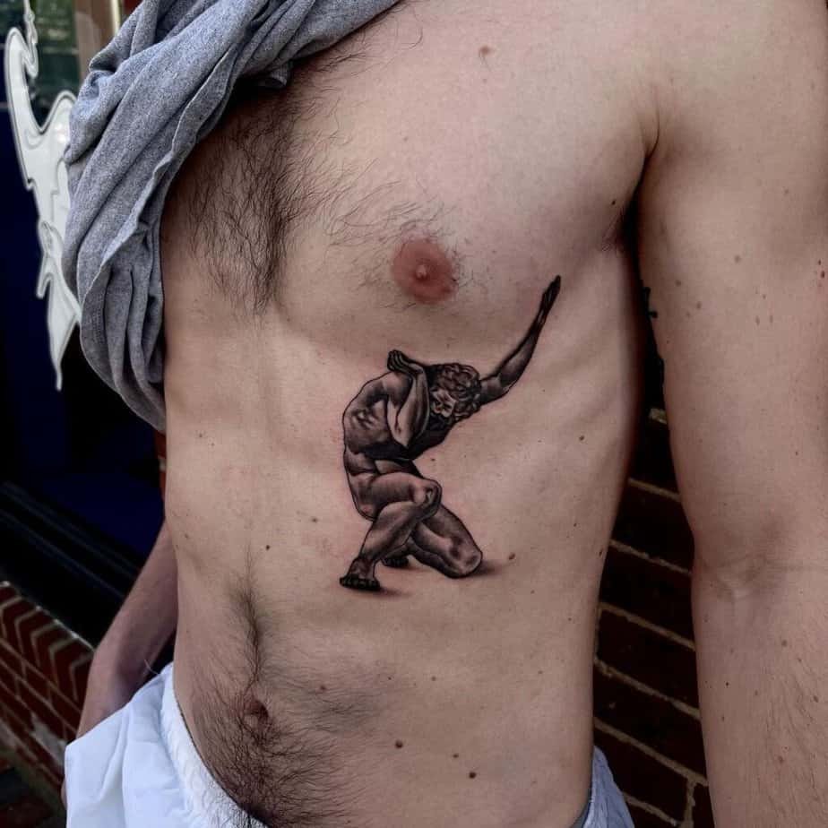 5. A tattoo of Atlas on the ribcage
