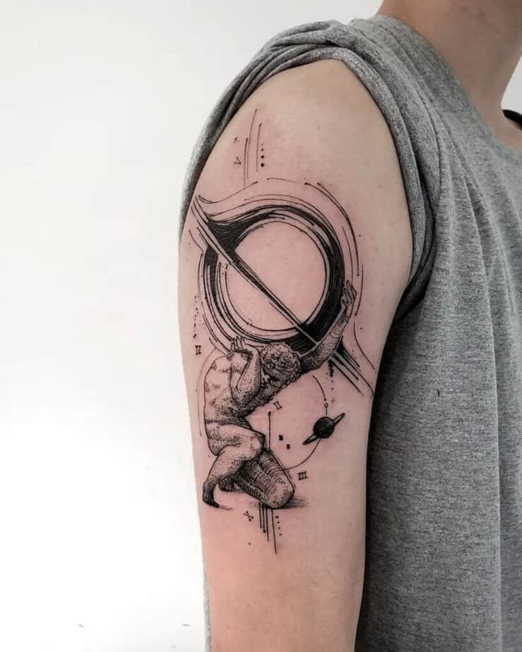 6. An abstract Atlas tattoo on the upper arm