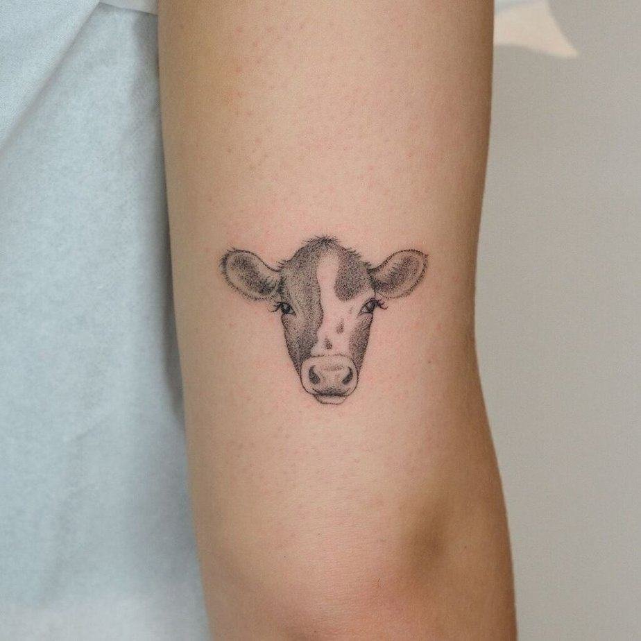 16. A dotwork cow tattoo