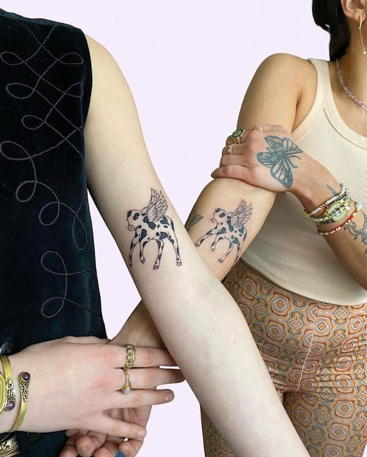20. A matching cow tattoo with wings