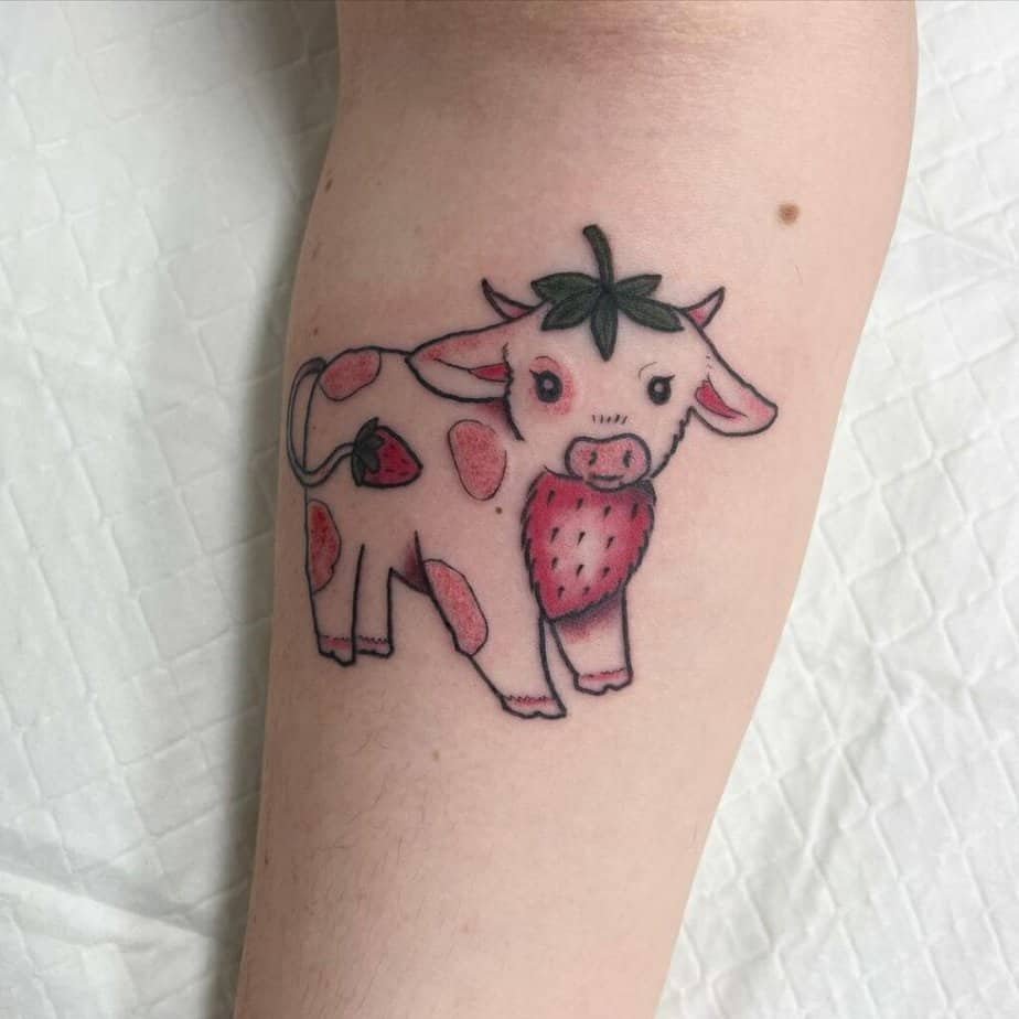 6. A strawberry cow tattoo
