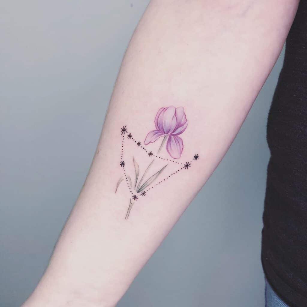20. A Capricorn constellation tattoo with a flower 