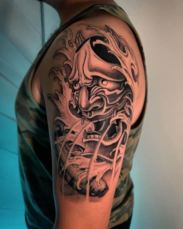11. Japanese-inspired mask tattoo