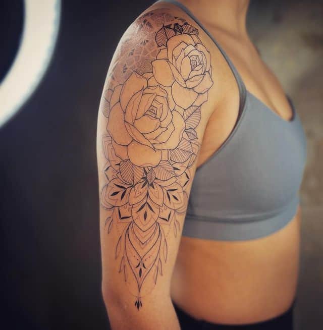 8. Roses and mandalas half-sleeve tattoo