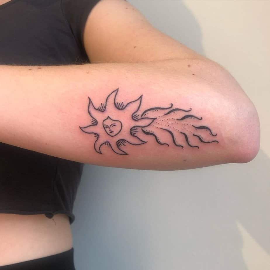 16. A tattoo of a shooting star with a face