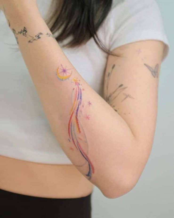 22. A colorful shooting star tattoo