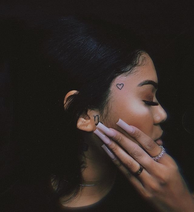 8. Stunning heart face tattoo