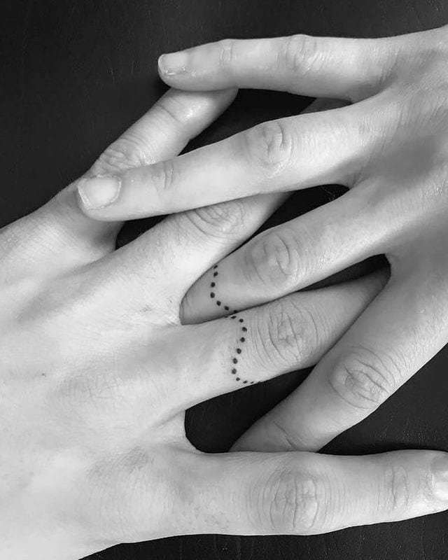21. Trendy finger matching couple tattoos
