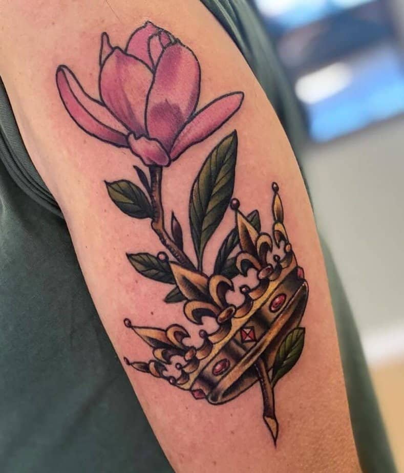 13. A traditional crown tattoo with a magnolia