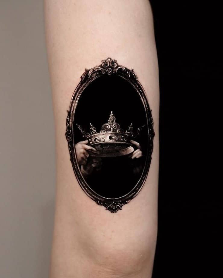 16. A blackwork crown tattoo