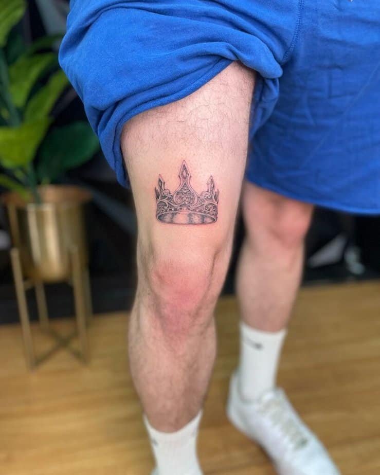 4. A crown tattoo on the thigh