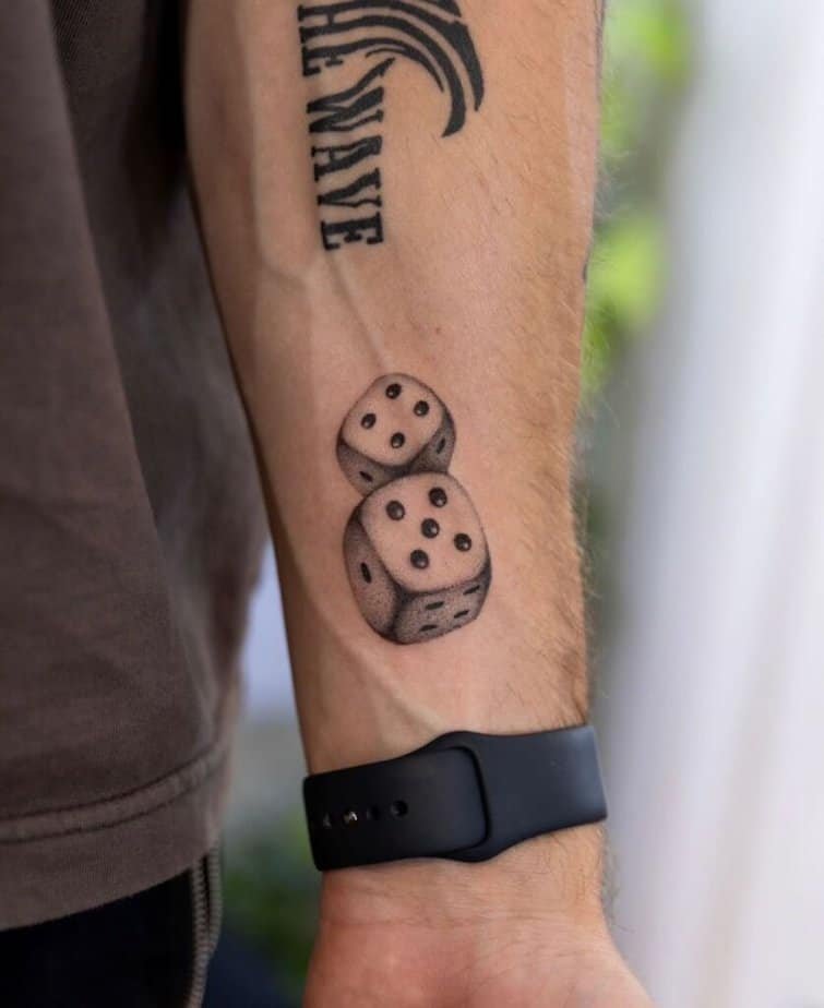8. Dice tattoo on the wrist 