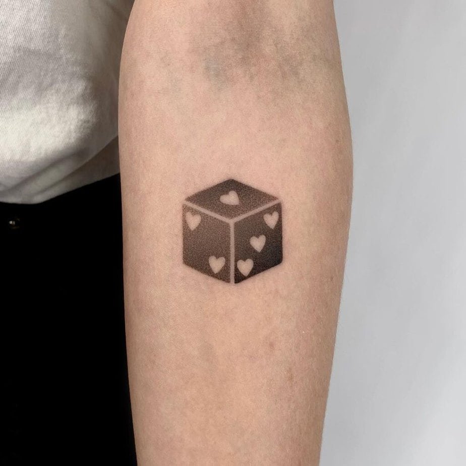 10. Dotwork dice tattoo on the forearm