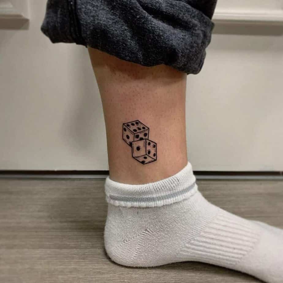 12. Dice tattoo on the ankle 